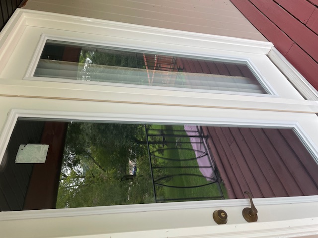After: new white trim and finished door opening onto the repaired deck